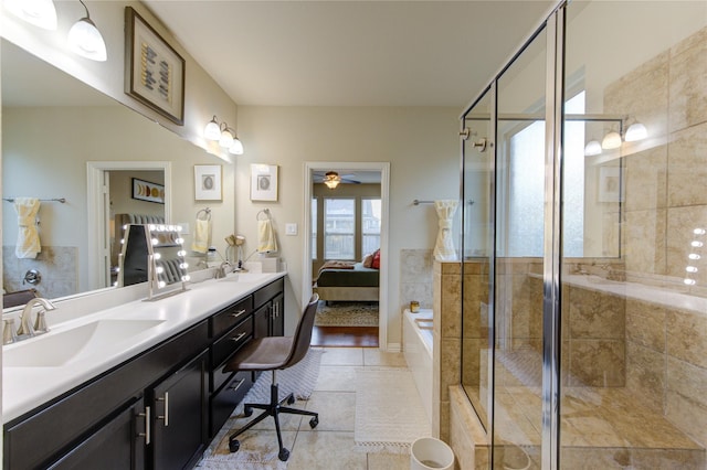 bathroom with vanity, an enclosed shower, and tile patterned flooring