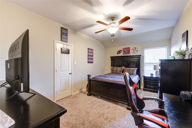 bedroom featuring ceiling fan, lofted ceiling, and light carpet