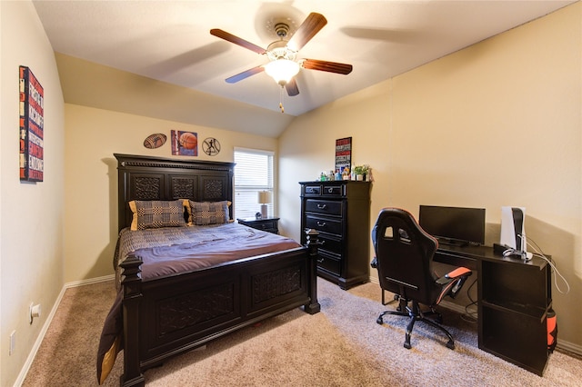 carpeted bedroom featuring ceiling fan and vaulted ceiling