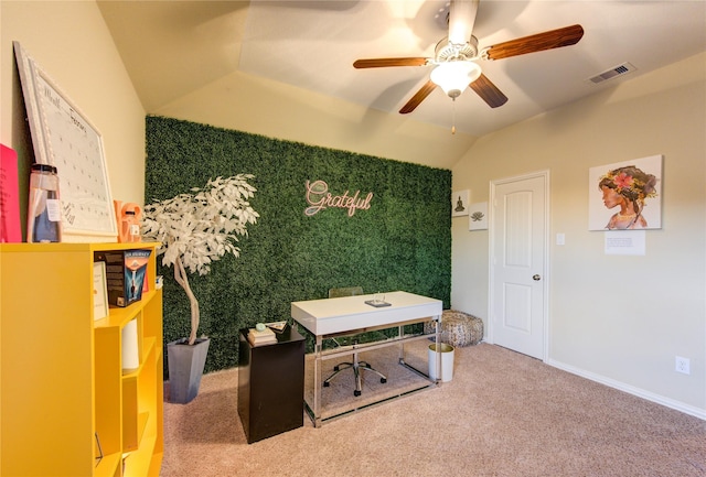 home office featuring ceiling fan, vaulted ceiling, and carpet