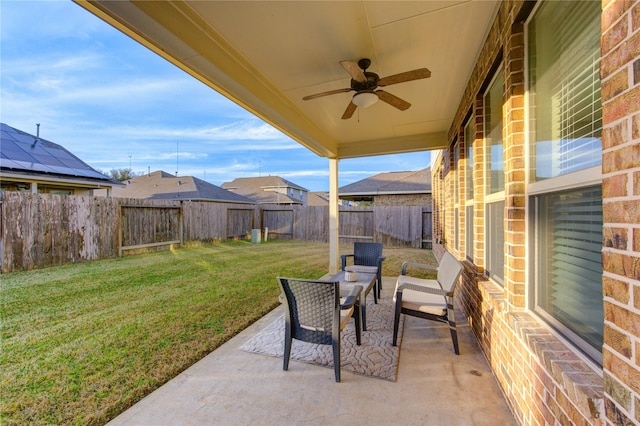 view of patio featuring ceiling fan