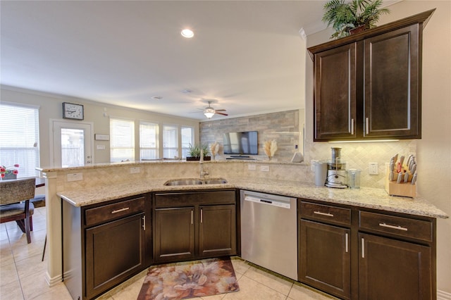 kitchen with dark brown cabinetry, sink, tasteful backsplash, stainless steel dishwasher, and kitchen peninsula