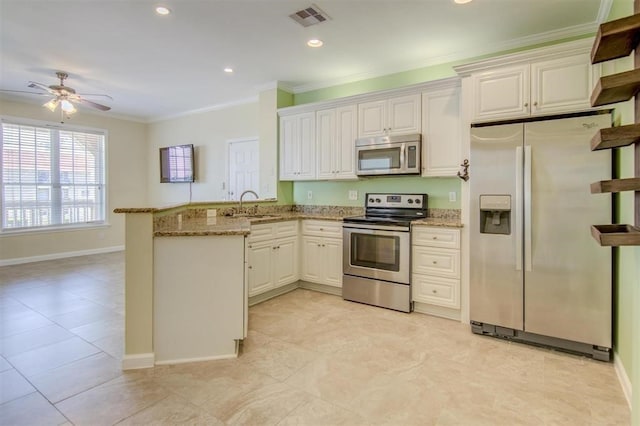 kitchen with ornamental molding, kitchen peninsula, stainless steel appliances, light stone countertops, and white cabinets