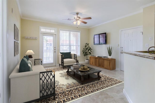 living room with crown molding and ceiling fan