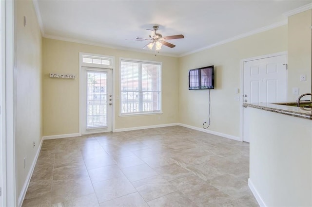 spare room with ceiling fan and ornamental molding