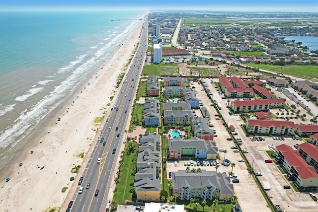 aerial view featuring a water view and a beach view