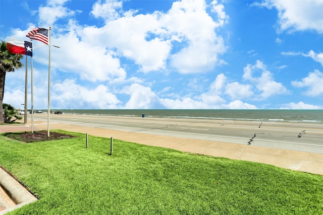 view of home's community featuring a view of the beach and a water view