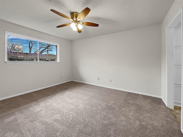 unfurnished room with ceiling fan and carpet floors