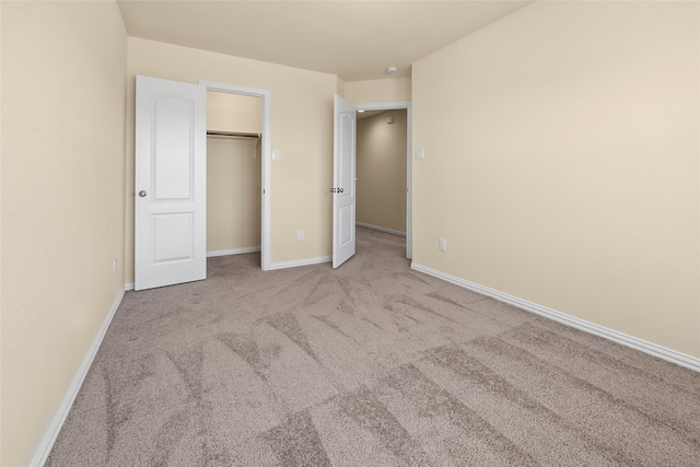 unfurnished bedroom featuring light carpet