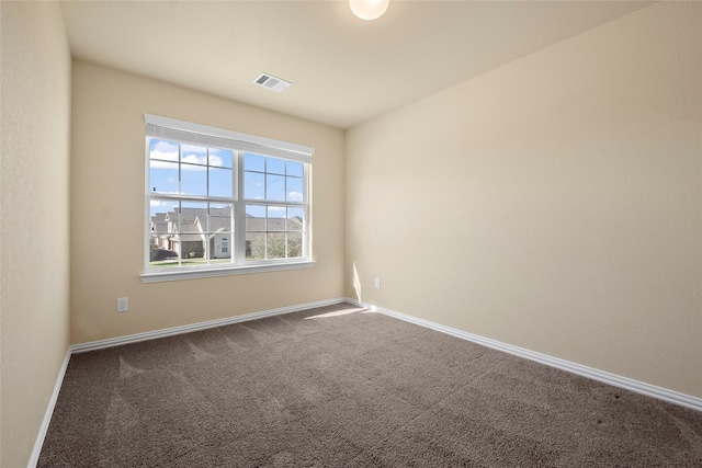 empty room with carpet flooring