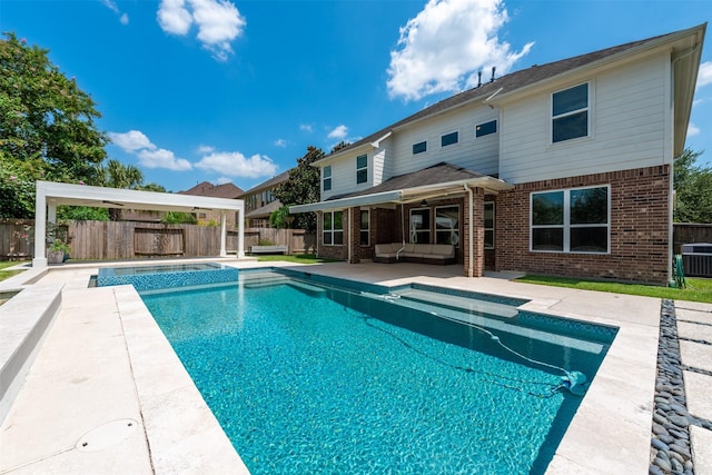 view of pool featuring an outdoor living space, a patio, and cooling unit