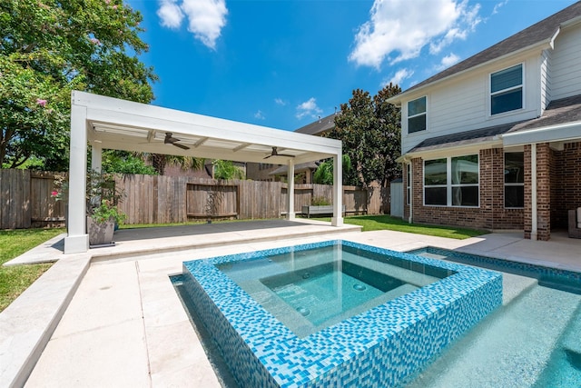 view of pool featuring an in ground hot tub, ceiling fan, and a patio