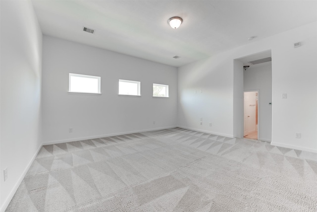 carpeted spare room with plenty of natural light