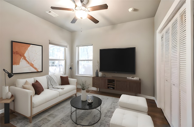 living room featuring hardwood / wood-style flooring and ceiling fan