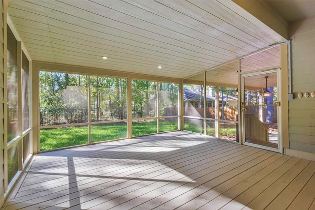 unfurnished sunroom featuring plenty of natural light