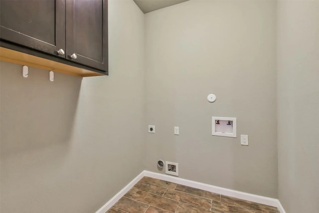 laundry area with cabinets, electric dryer hookup, hookup for a washing machine, and hookup for a gas dryer