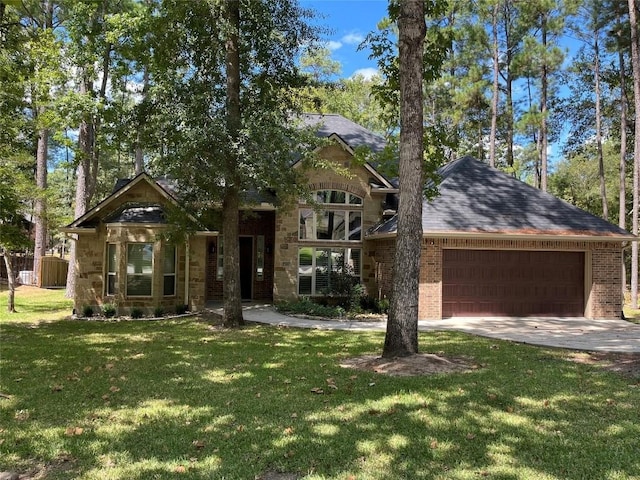 view of front facade with a garage and a front lawn