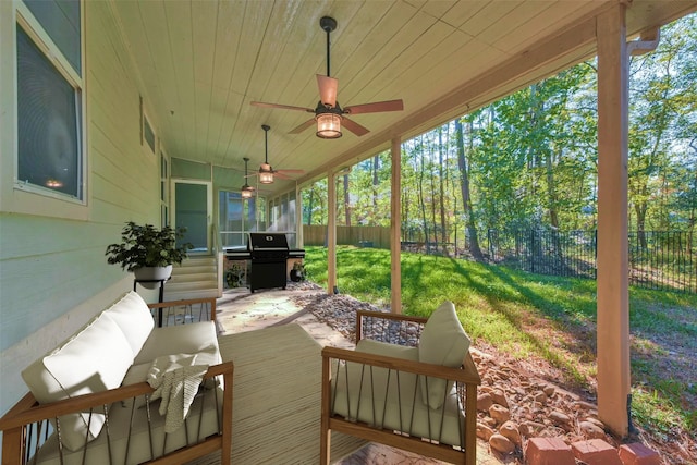 view of patio featuring a grill and ceiling fan