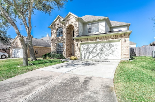 front facade featuring a garage and a front lawn