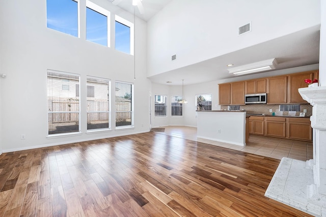 unfurnished living room featuring light wood-type flooring