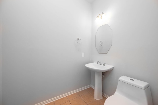 bathroom with tile patterned floors and toilet