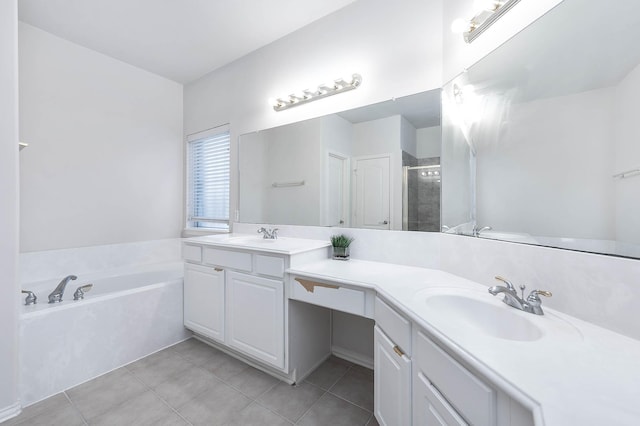 bathroom with tile patterned floors, vanity, and shower with separate bathtub