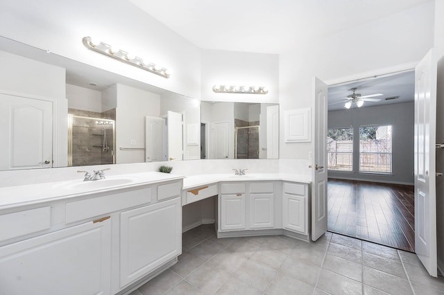 bathroom featuring vanity, tile patterned floors, ceiling fan, and a shower with shower door