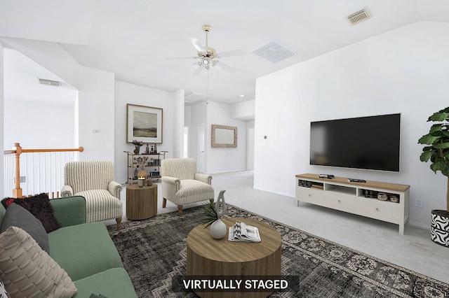 carpeted living room with vaulted ceiling and ceiling fan