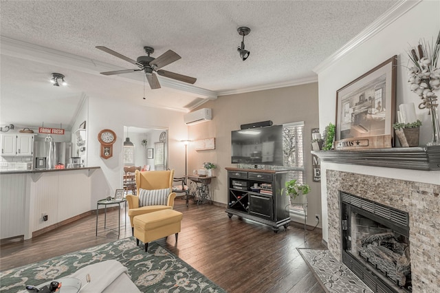 living room with a tile fireplace, vaulted ceiling, dark hardwood / wood-style floors, ornamental molding, and a textured ceiling