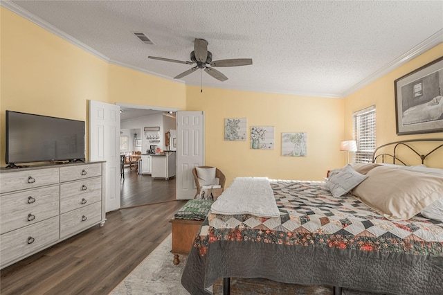 bedroom with ceiling fan, ornamental molding, dark hardwood / wood-style flooring, and a textured ceiling