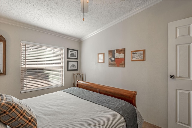 bedroom with ceiling fan, ornamental molding, and a textured ceiling