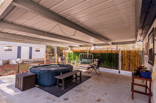 view of patio with a hot tub