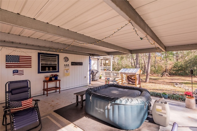 view of patio / terrace featuring a hot tub