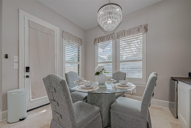 dining area with an inviting chandelier