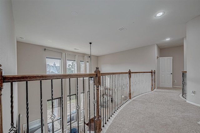 hallway featuring carpet