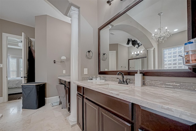 bathroom featuring vanity and decorative columns