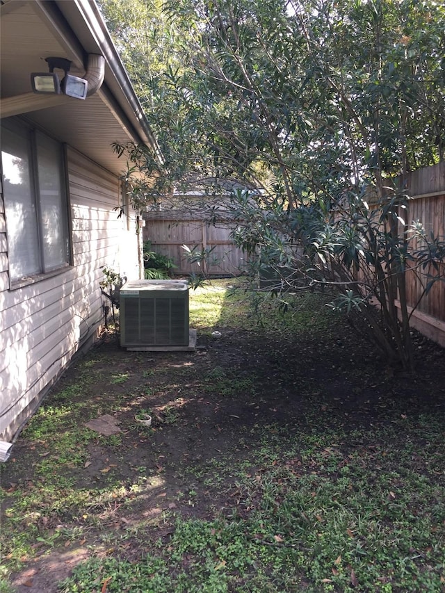 view of yard featuring central AC unit