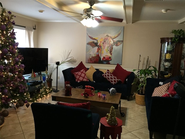 living room with ceiling fan, ornamental molding, and light tile patterned floors