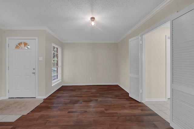 entryway featuring crown molding, dark hardwood / wood-style floors, and a textured ceiling