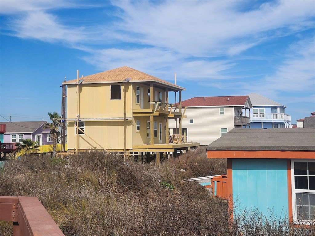 back of property featuring a balcony