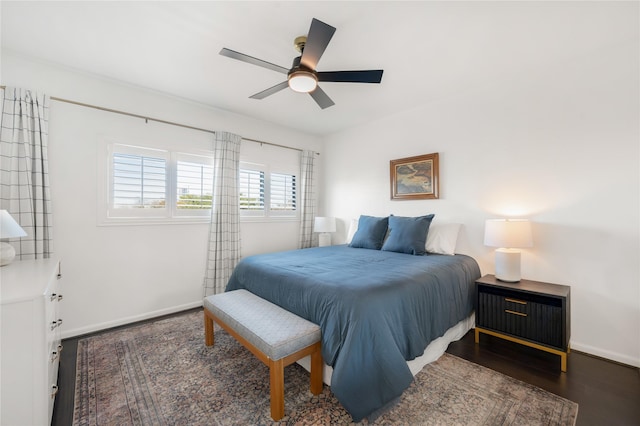 bedroom featuring dark wood-type flooring and ceiling fan