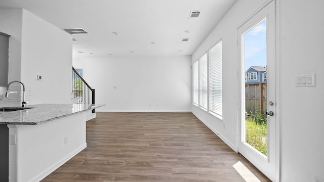 214 Fulton Station Dr, Houston, TX 77009 - interior space with stairway, wood finished floors, visible vents, a sink, and baseboards