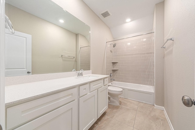 full bathroom featuring vanity, tile patterned flooring, tiled shower / bath combo, and toilet