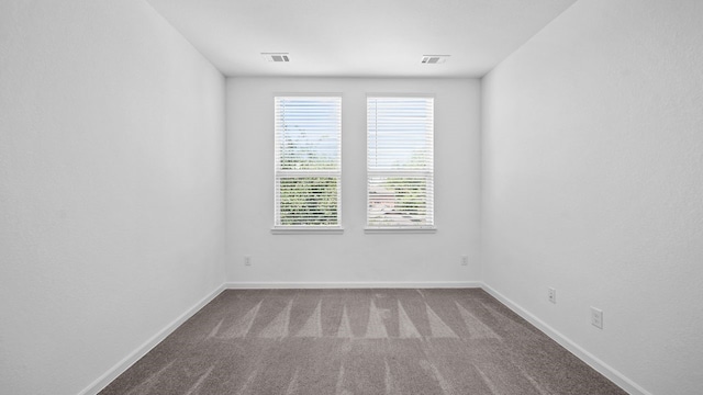 unfurnished room featuring carpet