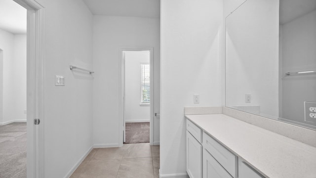 bathroom with vanity and tile patterned floors