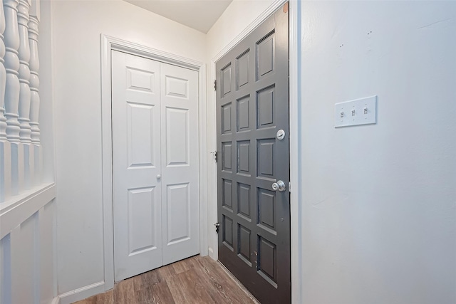 foyer entrance with hardwood / wood-style floors