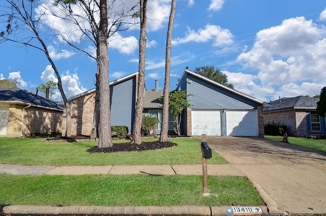 view of front of home with a garage and a front yard