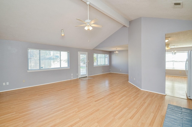 unfurnished living room with high vaulted ceiling, ceiling fan with notable chandelier, beam ceiling, and light hardwood / wood-style flooring