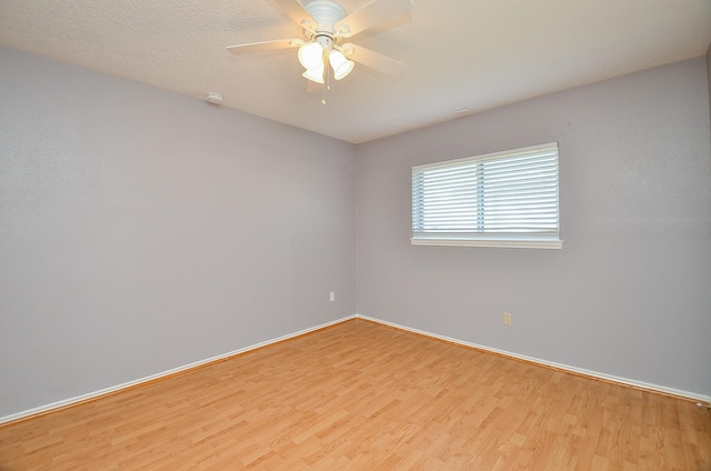 unfurnished room with ceiling fan and light hardwood / wood-style flooring