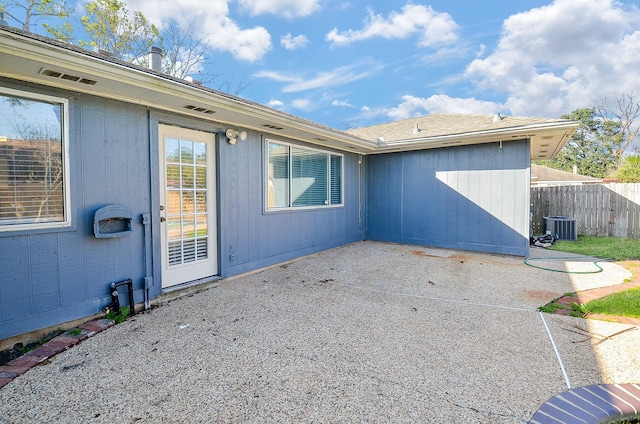 exterior space featuring central AC unit and a patio area